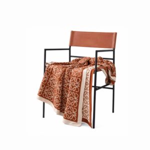 Luxe monogram throw blanket for modern homes in Lagos, Nigeria, featuring a sophisticated designer-inspired pattern for sofas, beds, and armchairs.